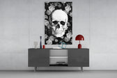 Skull glass wall art catching light to reveal its painted petals