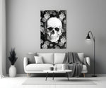 Close-up detail of monochrome skull and roses behind glass
