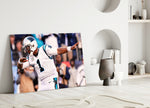 Close-up detail of Cam Newton dab behind glass
