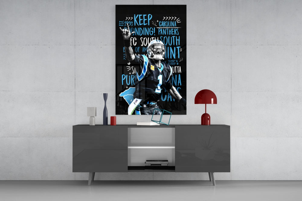 Cam Newton glass wall art catching light to reveal its painted typography