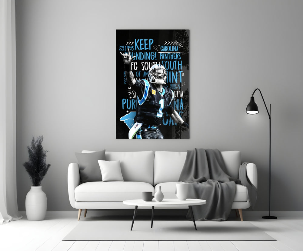 Close-up detail of Cam Newton Keep Pounding poster behind glass