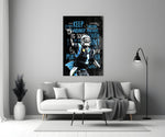 Close-up detail of Cam Newton Keep Pounding poster behind glass