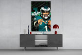 Jalen Hurts glass wall art catching light to reveal its painted typography