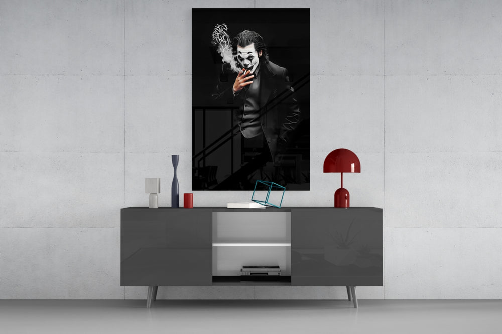 Joker glass wall art catching light to reveal its painted smoke