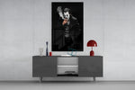 Joker glass wall art catching light to reveal its painted smoke