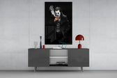 Joker glass wall art catching light to reveal its painted smoke