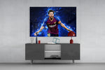 Messi glass wall art catching light to reveal its painted plasma