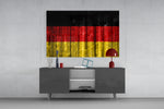 Flag of Germany glass wall art catching light to reveal its painted grain