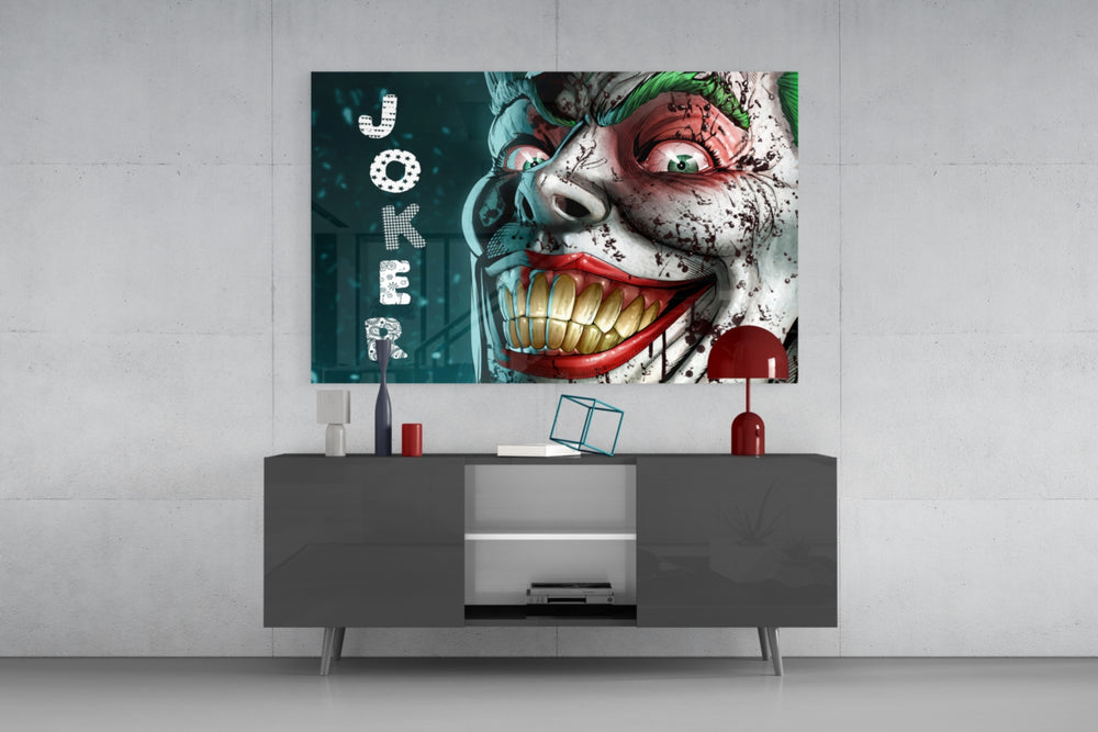 Joker glass wall art catching light to reveal its painted droplets