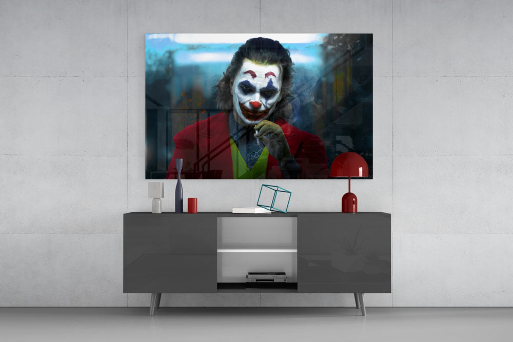 Joker glass wall art catching light to reveal its painted smoke
