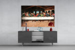 Last Supper Remastered glass wall art catching light to reveal its painted refectory