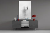 Despair glass wall art catching light to reveal its painted haze