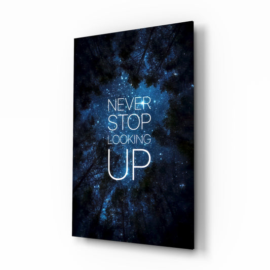 Never Stop glass wall art in a moody bedroom