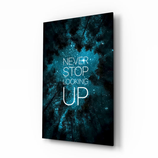 Never Stop glass wall art in a moody bedroom