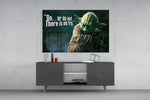 Words of Yoda glass wall art catching light to reveal its painted swamp