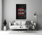 Close-up detail of scarlet No Pain No Gain bubble behind glass