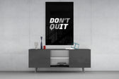 Don't Quit glass wall art catching light to reveal its painted shadow