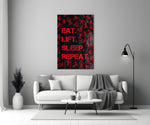 Close-up detail of scarlet Eat Lift Sleep Repeat typography behind glass