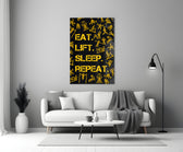 Close-up detail of saffron Eat Lift Sleep Repeat typography behind glass