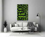 Close-up detail of chartreuse Eat Lift Sleep Repeat typography behind glass
