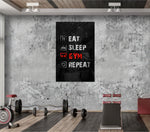 Eat, Sleep, Gym glass wall art catching light to reveal its painted icons