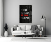 Close-up detail of Eat Sleep Gym Repeat icon list behind glass