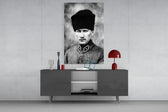 Atatürk glass wall art catching light to reveal its painted kalpak