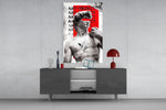 Art Object glass wall art catching light to reveal its painted newsprint