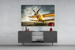 Aircraft glass wall art catching light to reveal its painted propeller