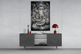 Ganesha glass wall art catching light to reveal its painted gold