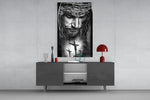 Jesus glass wall art catching light to reveal its painted thorns