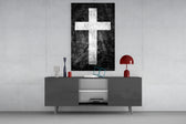 Cross glass wall art catching light to reveal its painted grunge