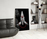 Sacred glass print bringing devotional edge to a moody bedroom