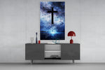 Cross glass wall art catching light to reveal its painted nebula