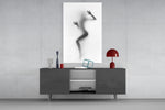 Woman Shadow glass wall art catching light to reveal its painted haze