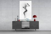 Woman Shadow glass wall art catching light to reveal its painted haze