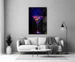 Close-up detail of cobalt-magenta neon martini behind glass