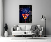 Close-up detail of ember-indigo martini splash behind glass