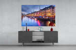 Nyhavn glass wall art catching light to reveal its painted lamps