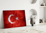 Close-up detail of grunge Turkish flag behind glass