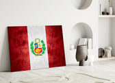 Close-up detail of grunge Peruvian coat-of-arms behind glass