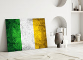 Close-up detail of grunge Irish tricolor behind glass