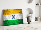 Close-up detail of grunge Tiranga and Ashoka Chakra behind glass
