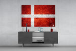 Flag of Denmark glass wall art catching light to reveal its painted stone-grunge