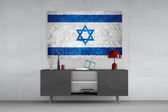 Flag of Israel glass wall art catching light to reveal its painted stone-grunge