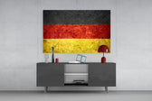 Flag of Germany glass wall art catching light to reveal its painted stone-grunge