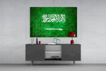 Flag of Saudi Arabia glass wall art catching light to reveal its painted stone-grunge