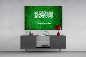 Flag of Saudi Arabia glass wall art catching light to reveal its painted stone-grunge