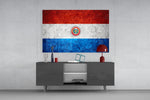 Flag of Paraguay glass wall art catching light to reveal its painted stone-grunge