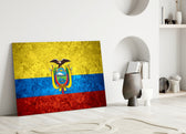 Close-up detail of rough-stone Ecuadorian condor emblem behind glass